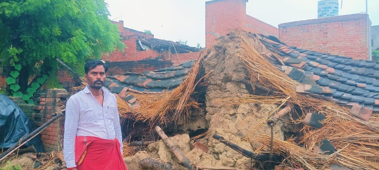 A shopkeeper's mud house collapsed due to rain, leaving household goods buried under the rubble