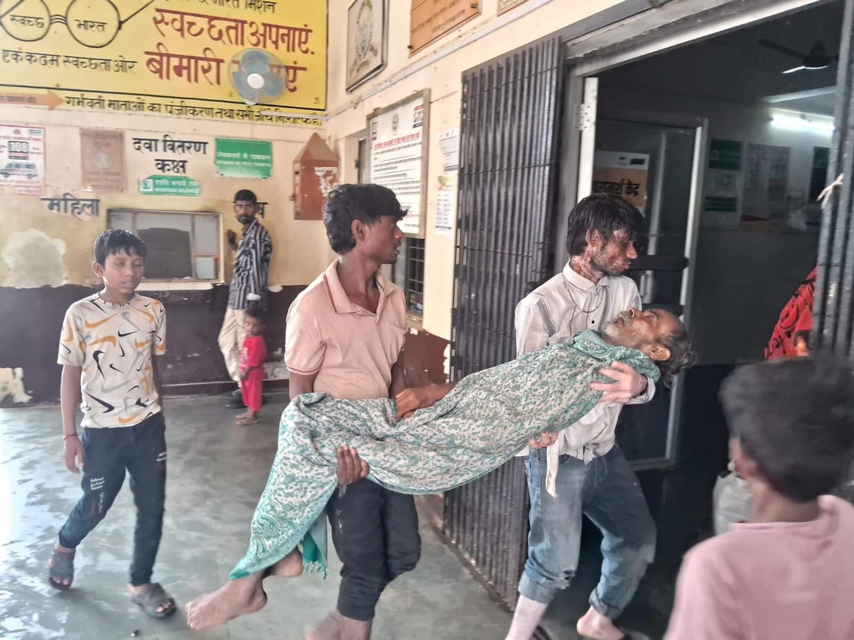 No stretcher available; patient carried in arms.