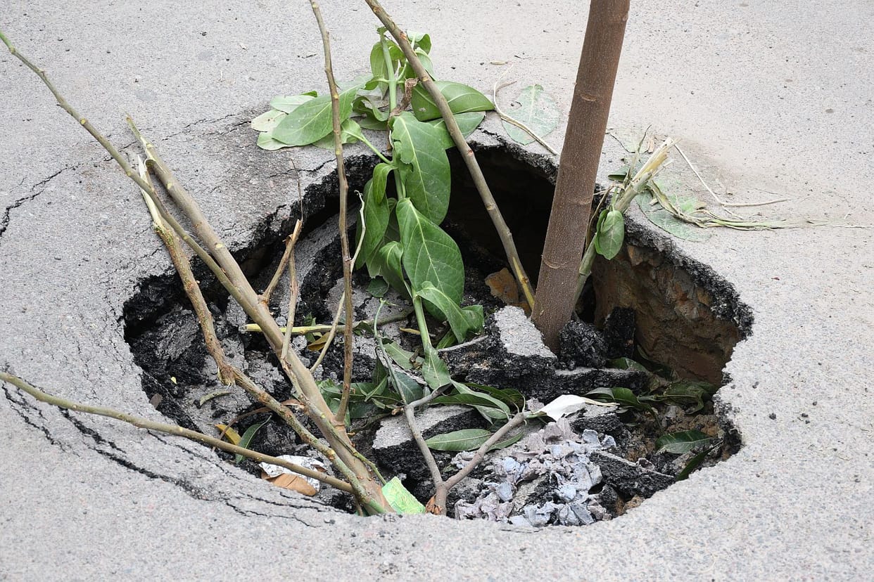 Road caves in opposite Midland Hospital in Lucknow sudden formation of pothole raises risk of accidents