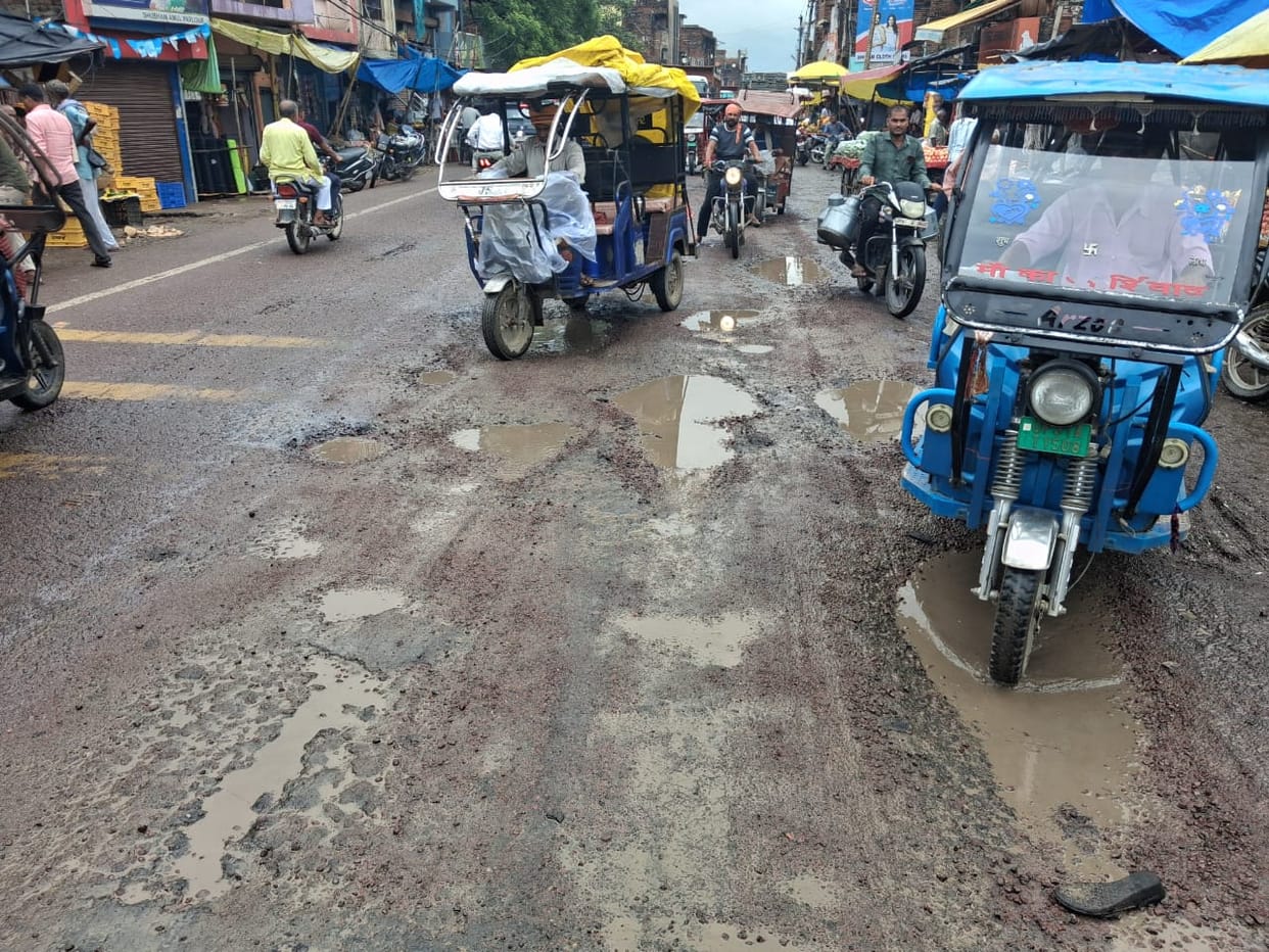 On the Kanpur-Sagar Highway, one has to search for the road amidst the potholes