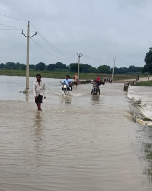 Water overflowing the causeways; village access routes blocked for 10 days.