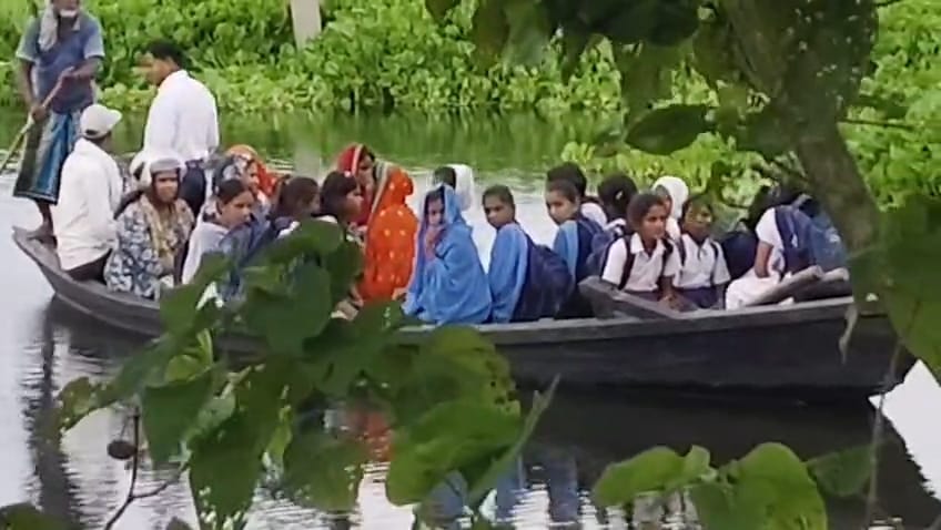 Flooded School, Children Risk Their Lives, Rely on Boats to Reach Classes