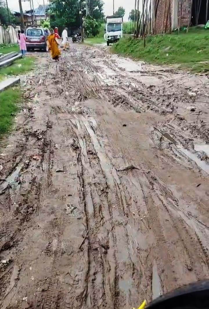 Commuters facing trouble reaching the weekly vegetable market due to the bad road.