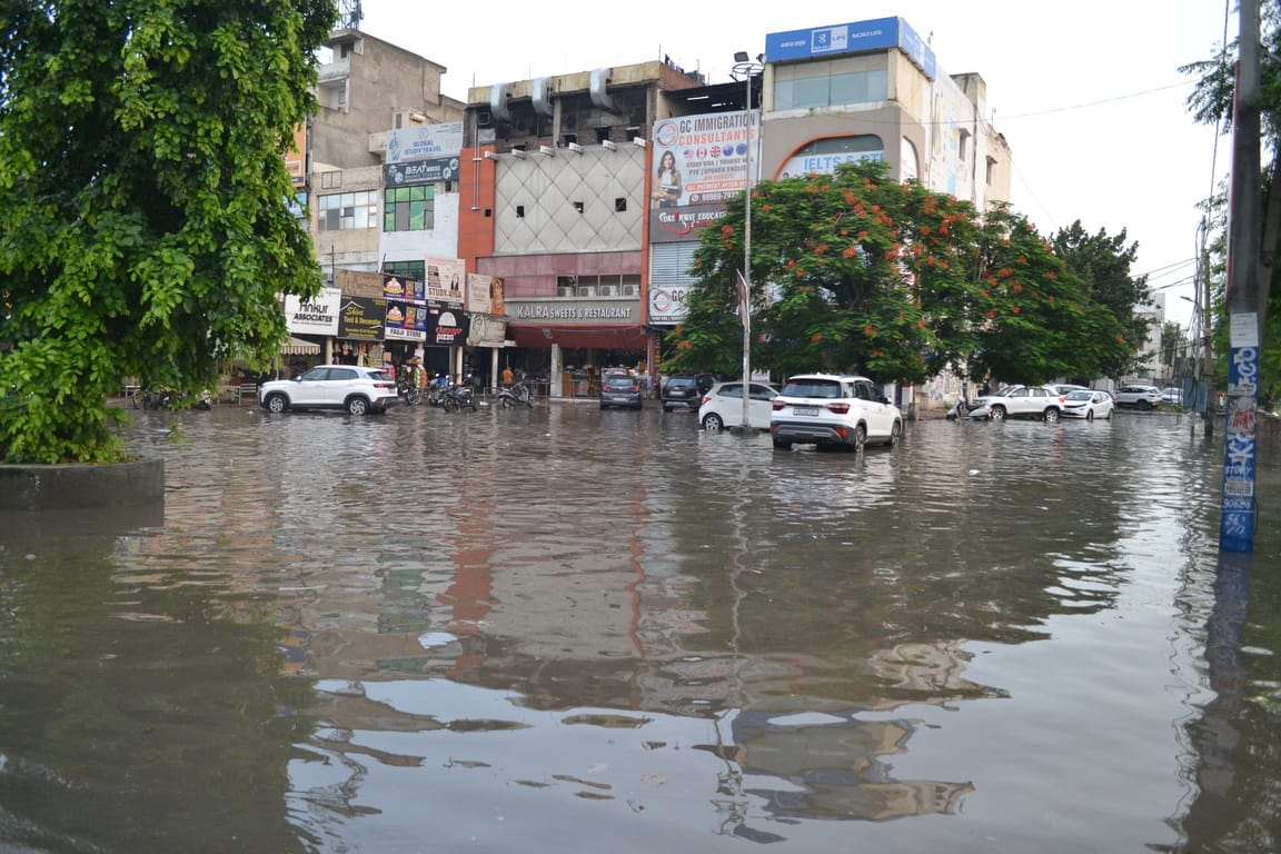 Drains not cleaned for a month; city submerged in rain.