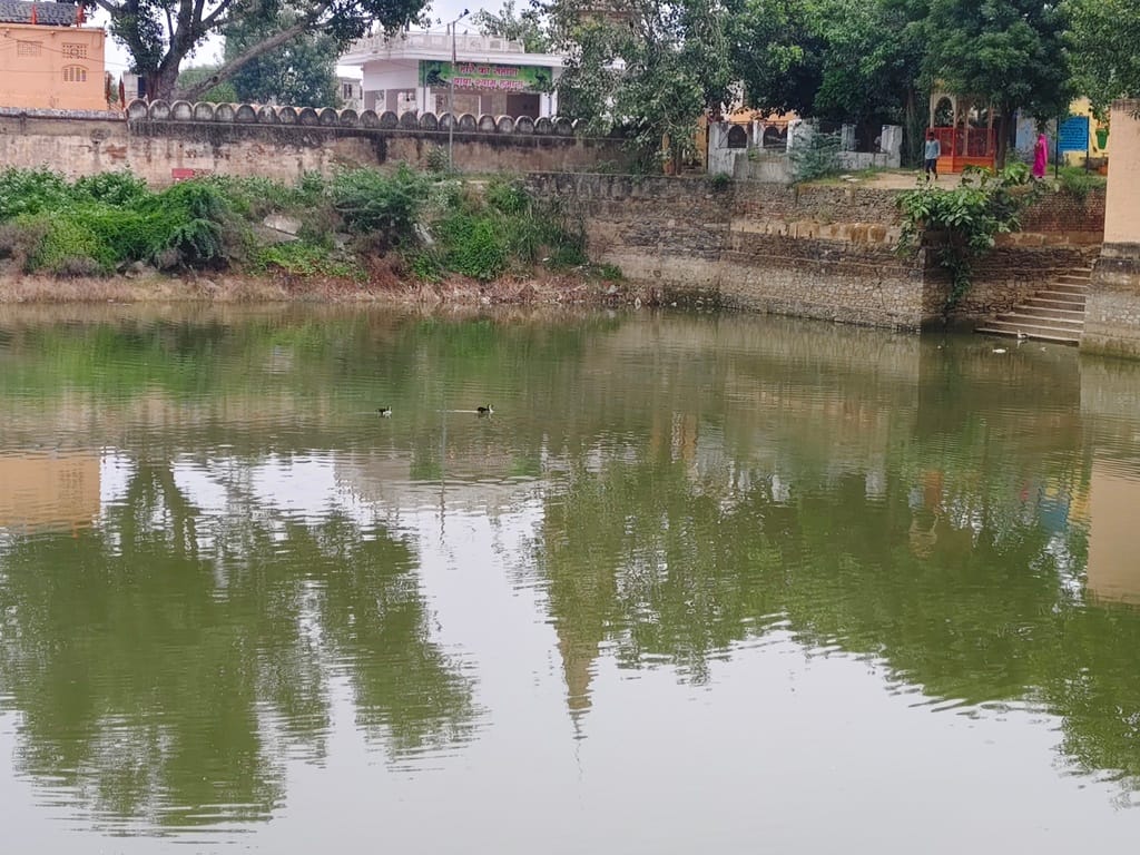An eerie silence descended upon Agad Bam Johad after the discovery of the former Sarpanch's body.