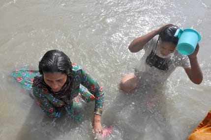 Devotees thronged the Jia Sangam for a holy dip.