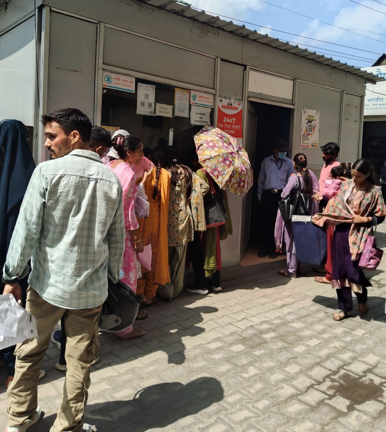 Patients forced to wait for hours in the scorching sun.