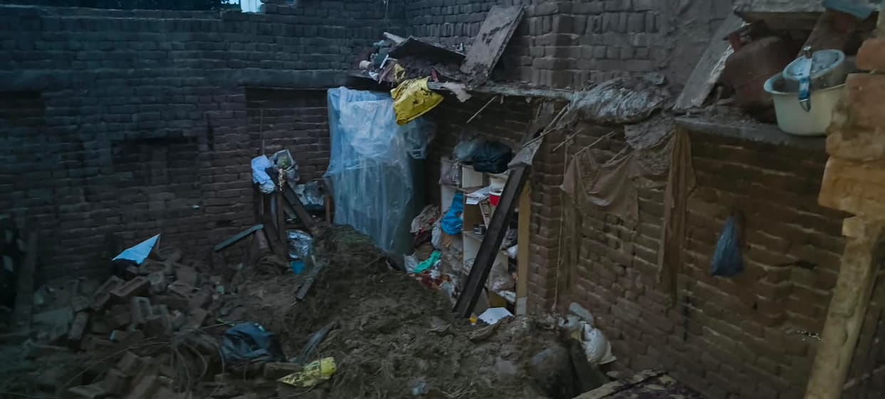 A house collapsed in heavy rain, and belongings were buried under the rubble.