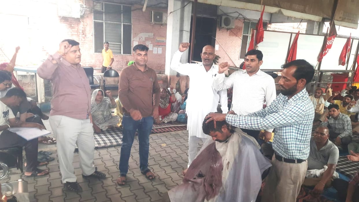 15 employees had their heads shaved in support of their pending demands
