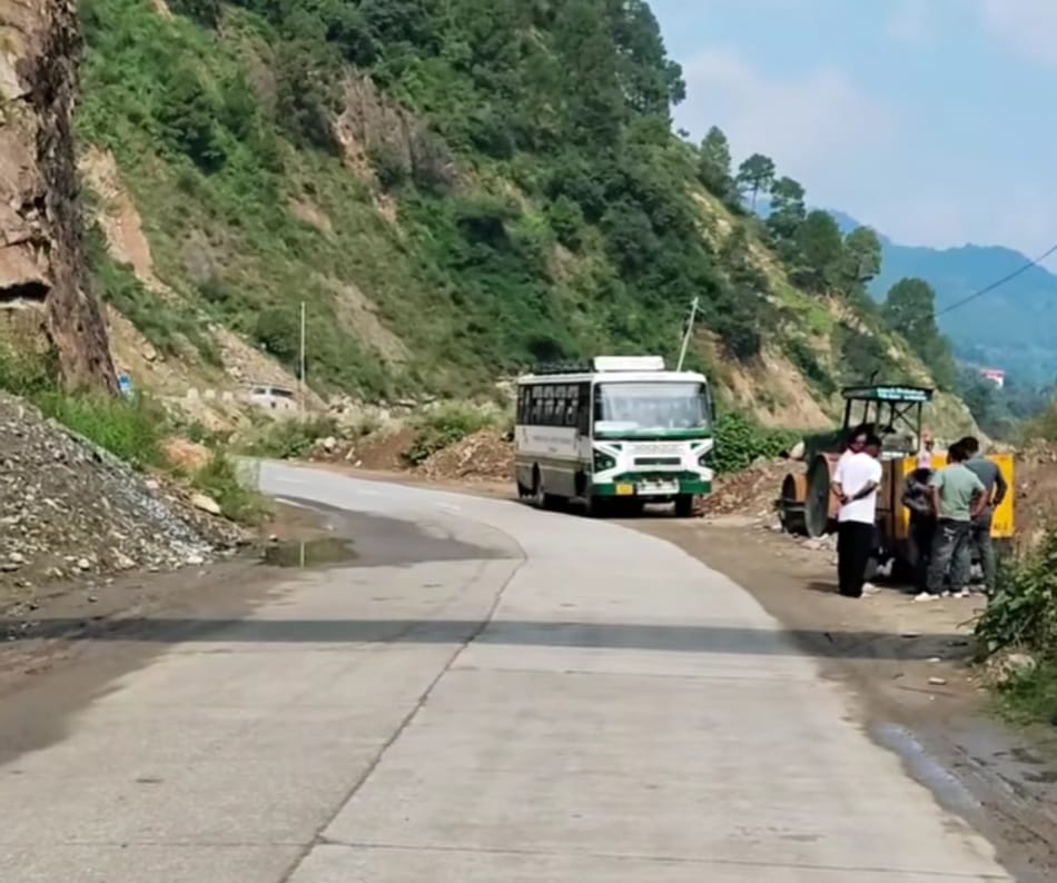 A broken-down government bus parked by the highway for two days.