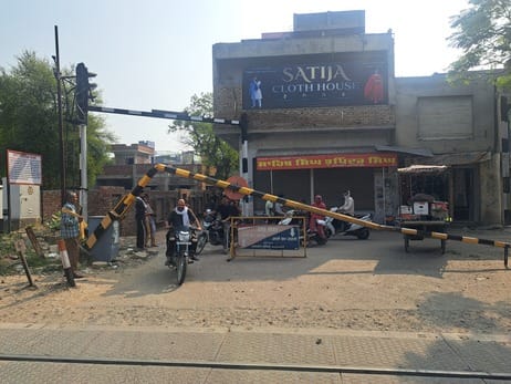 A part of the railway crossing is broken.