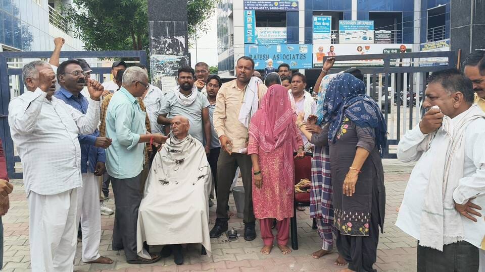 11 sanitation workers shaved their heads to protest against the government.