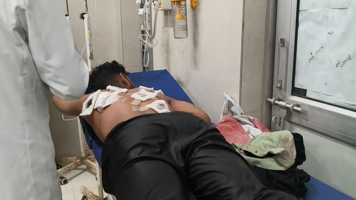 A young man was stabbed repeatedly outside a college, three people have been named