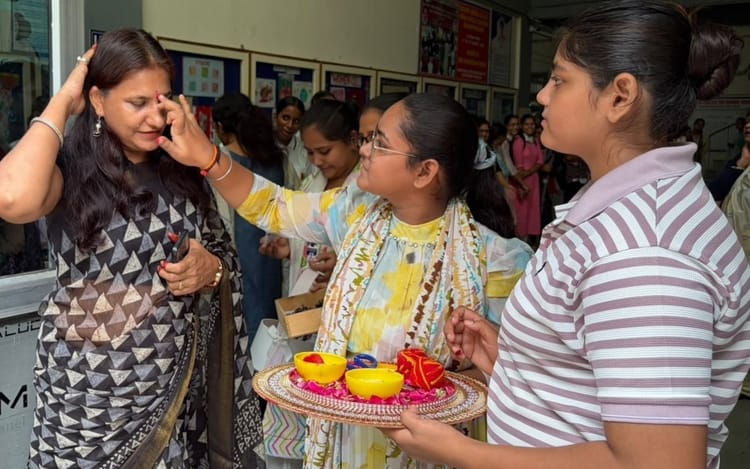 Teachers were welcomed by applying a tilak.