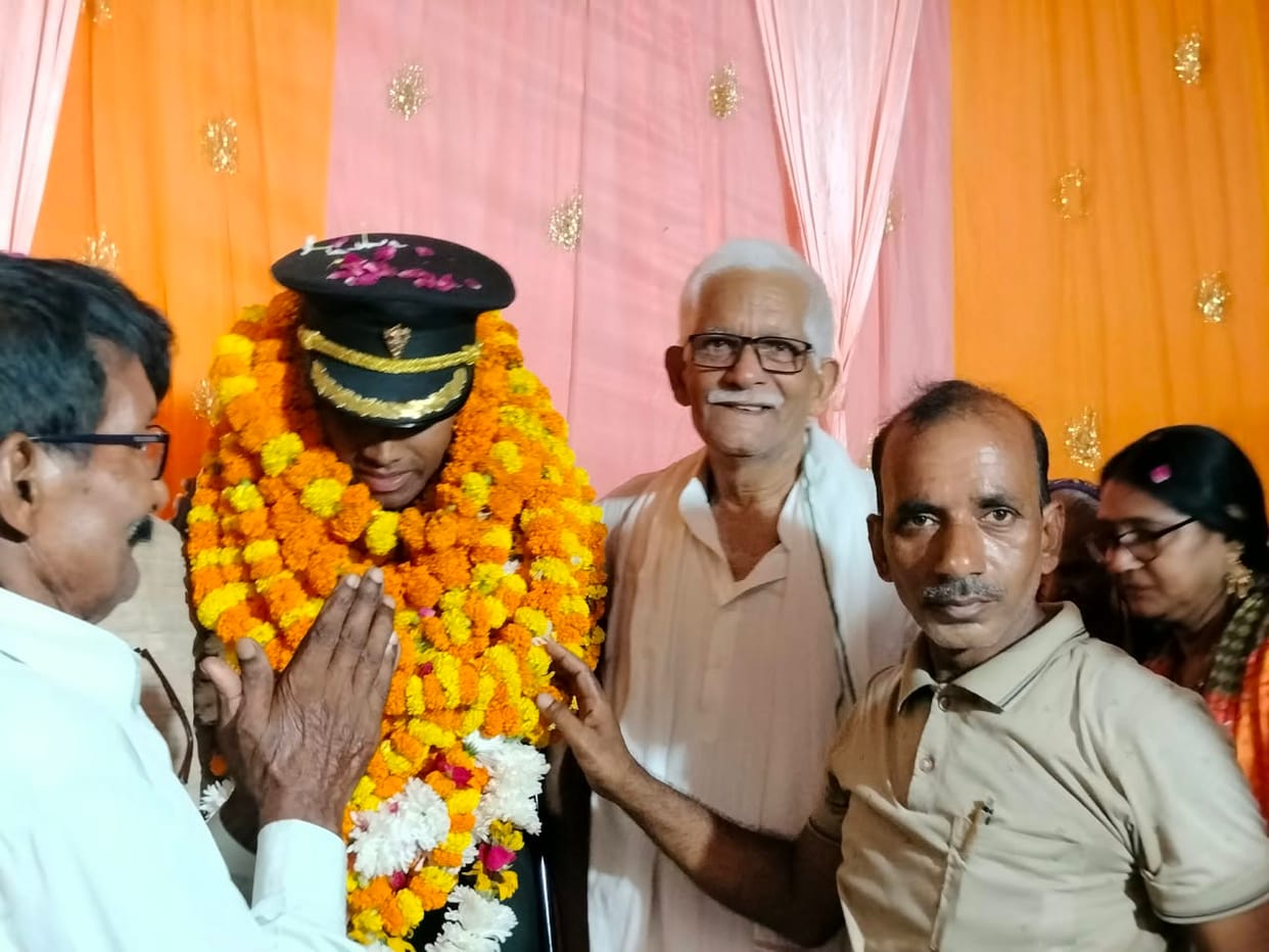 Third generation of a military family dons an officer's uniform.