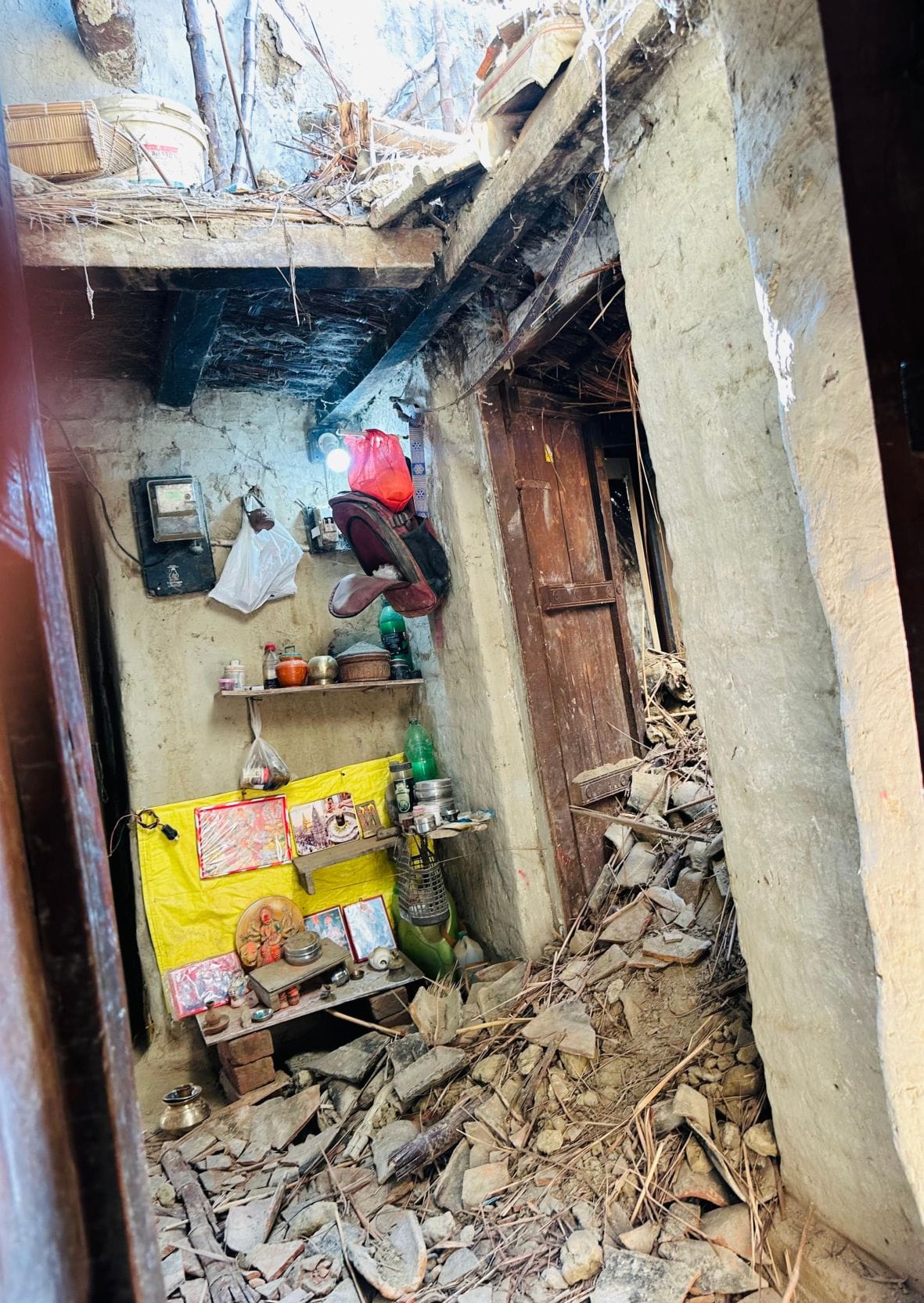 A woman lost her life when the parapet of the house collapsed while she was sleeping.