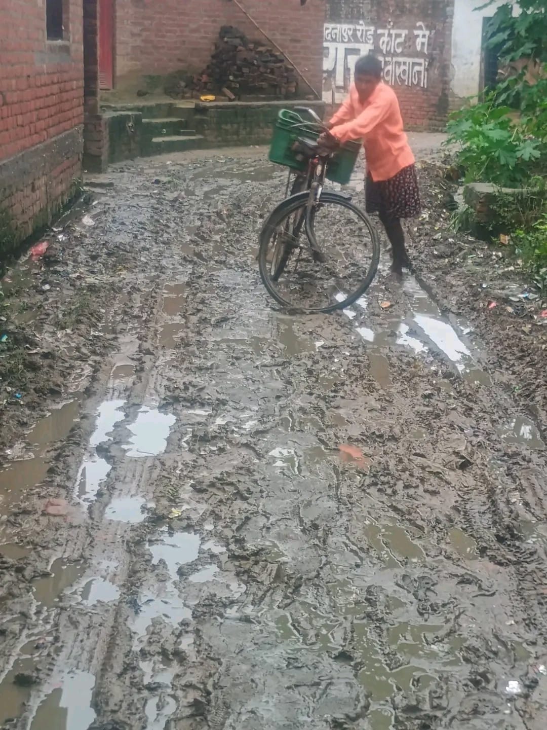 Villagers in Mahmadpur Azamabad are forced to wade through mud.
