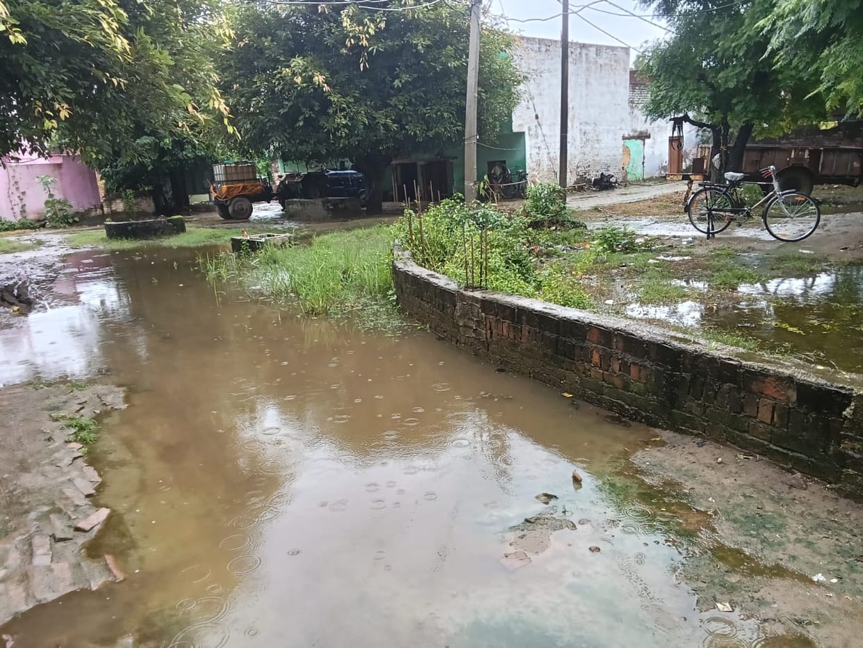 Rainwater and wastewater from houses have accumulated on the path due to the absence of drains.