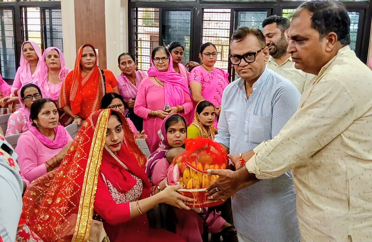 Anganwadi workers and helpers honored for outstanding work.