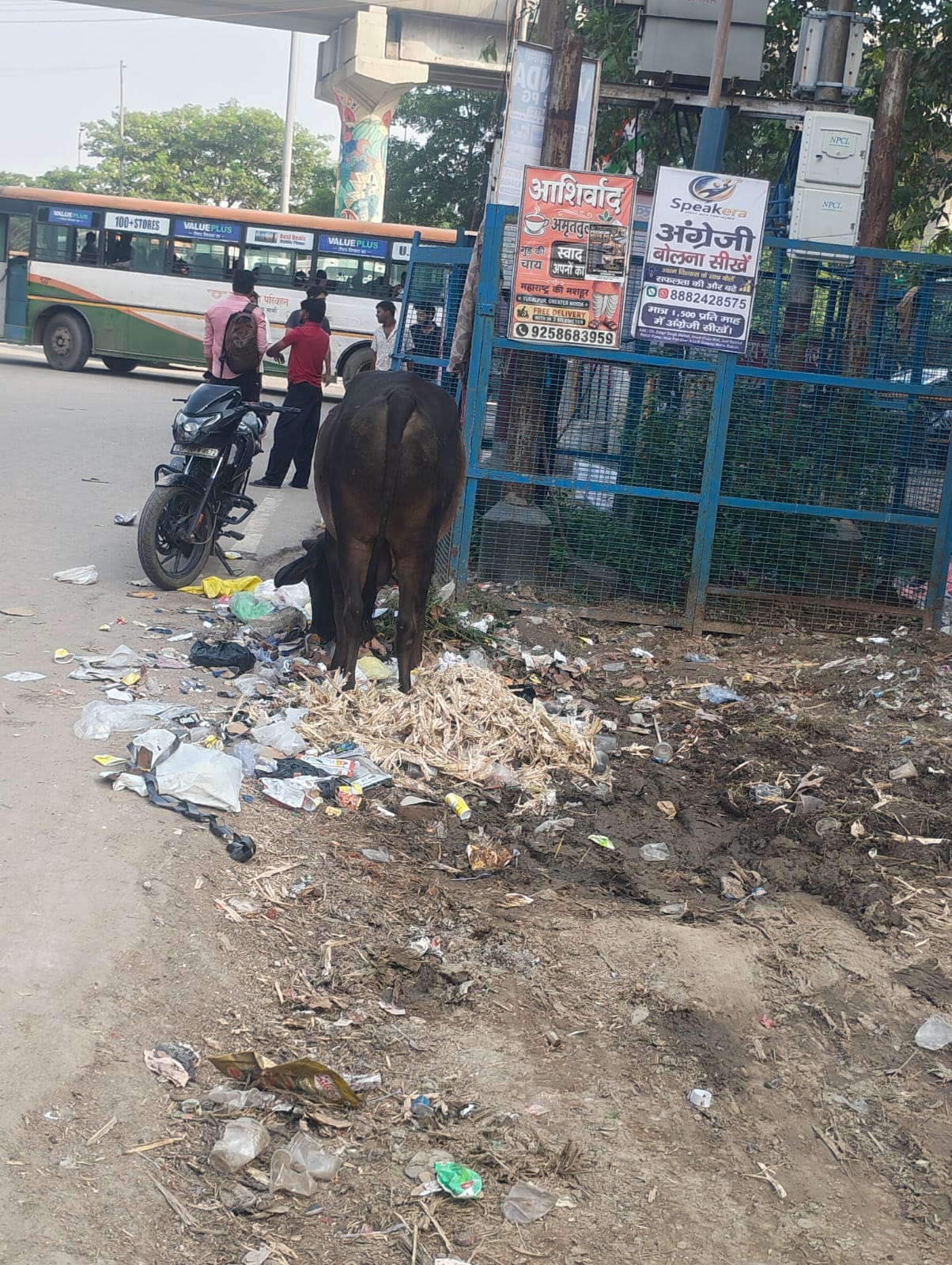 Garbage pile near police outpost; passersby troubled by the stench.