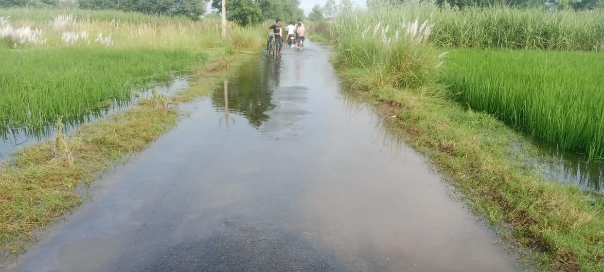 The Bisuhi River has also overflowed; water is flowing over the bridge