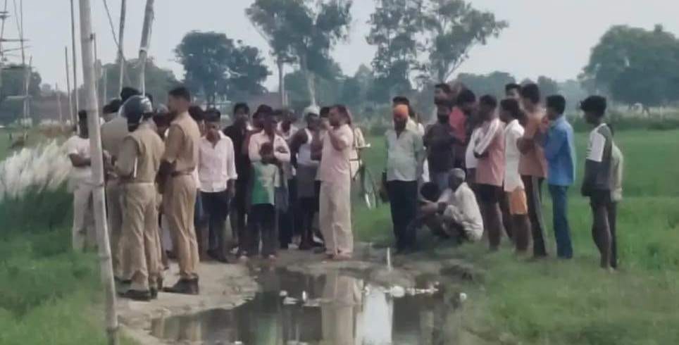 The body of a young man was found hanging from a bamboo pole with a towel tied to it.