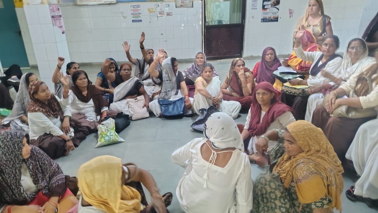 Controversy escalates over the transfer of the CHC in-charge; ASHA workers come out in support and stage a sit-in protest.