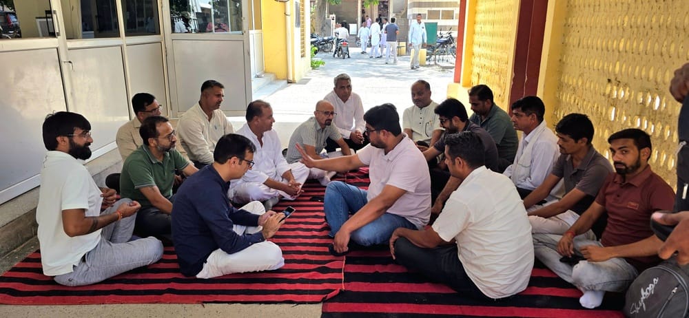 Employees stage sit-in against Kuldeep Bishnoi-supporting chairman; market operations disrupted.