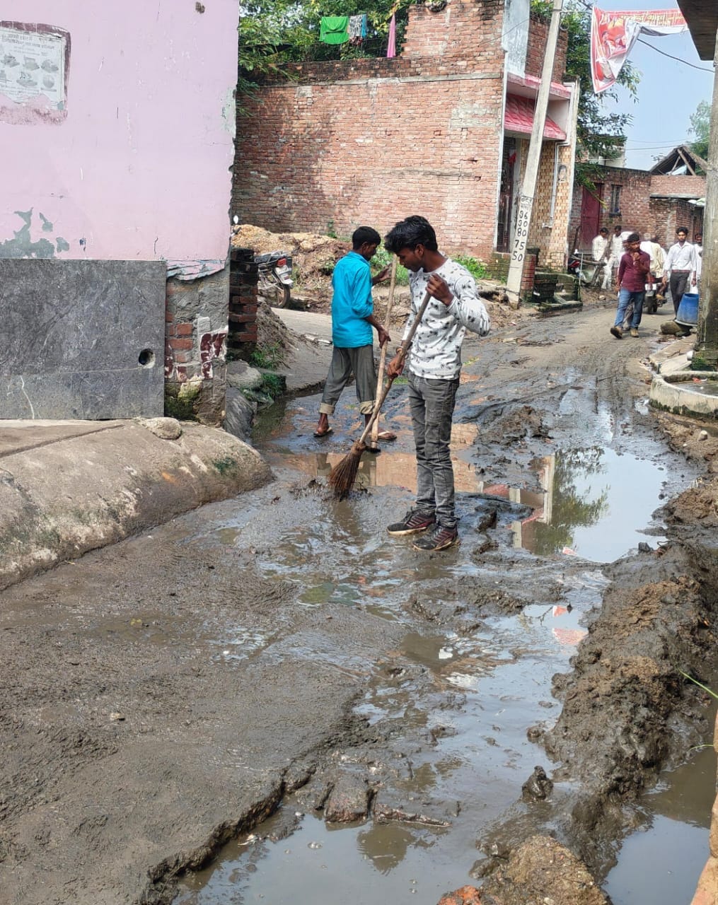 The biers of devotees were carried through mud-drenched streets.