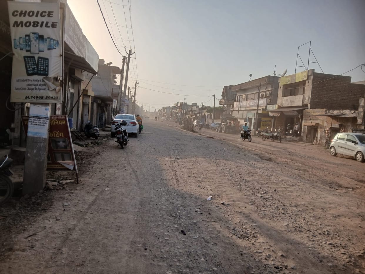 Rajaund's main road disappears in clouds of dust; commuters face increased difficulties.
