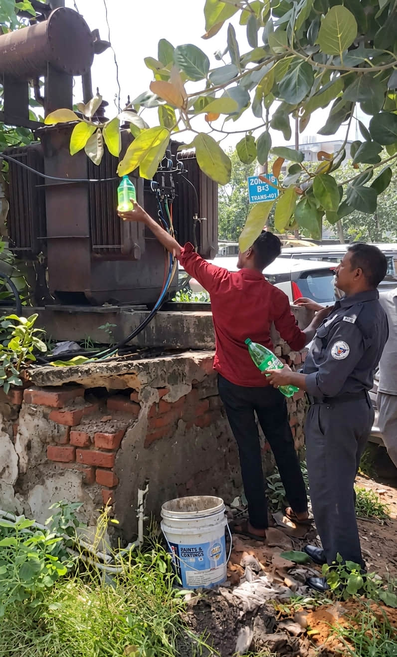 Oil leaked after a hole formed in the transformer; people collected it in bottles and took it away.