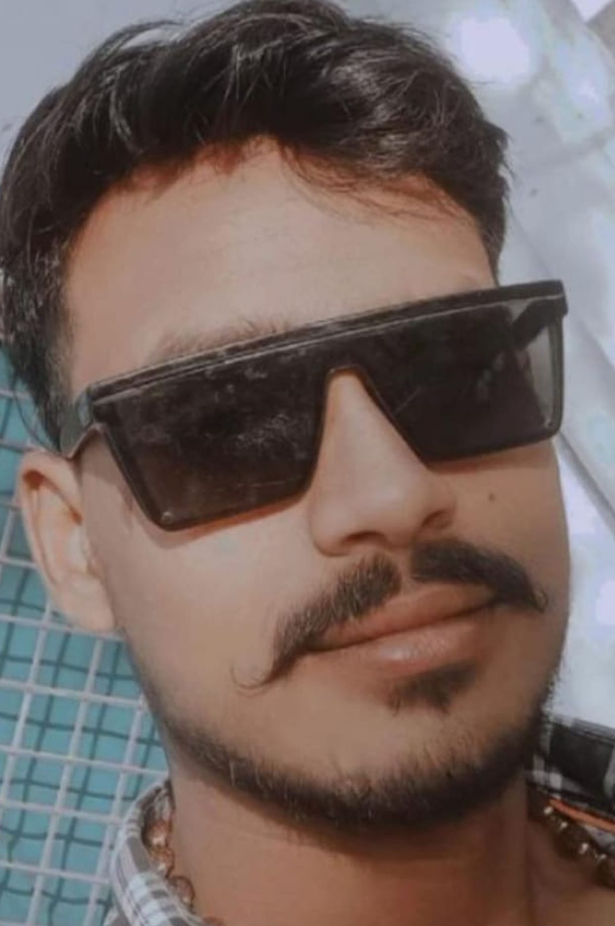 Son killed, mother injured after being hit by a container truck.