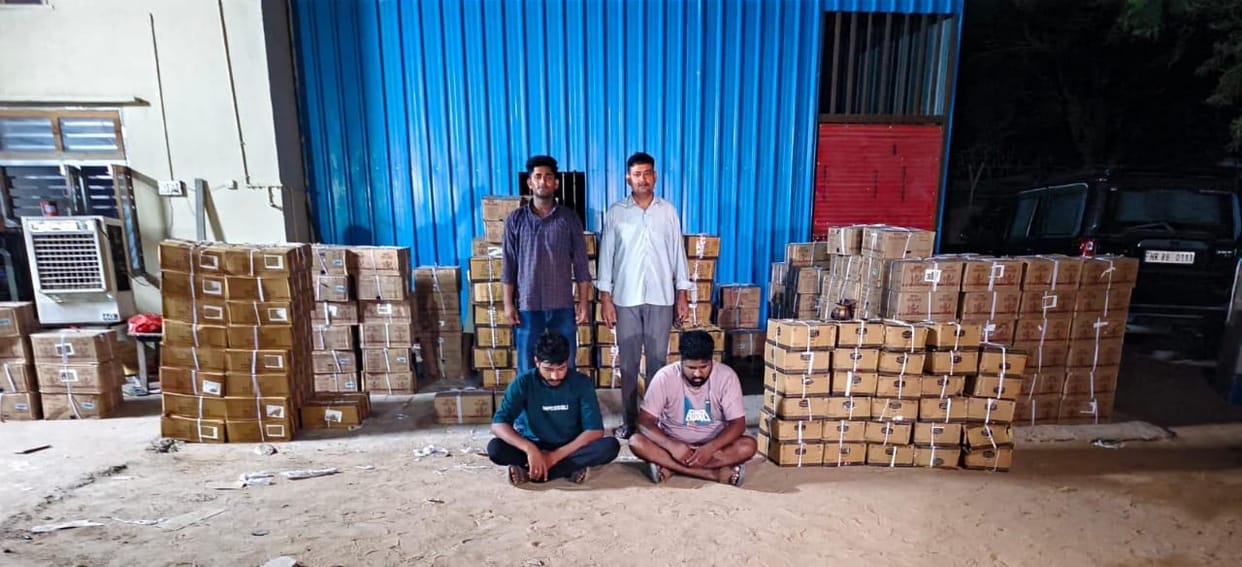 Liquor worth lakh hidden behind bicycle cartons; container intercepted at toll plaza.