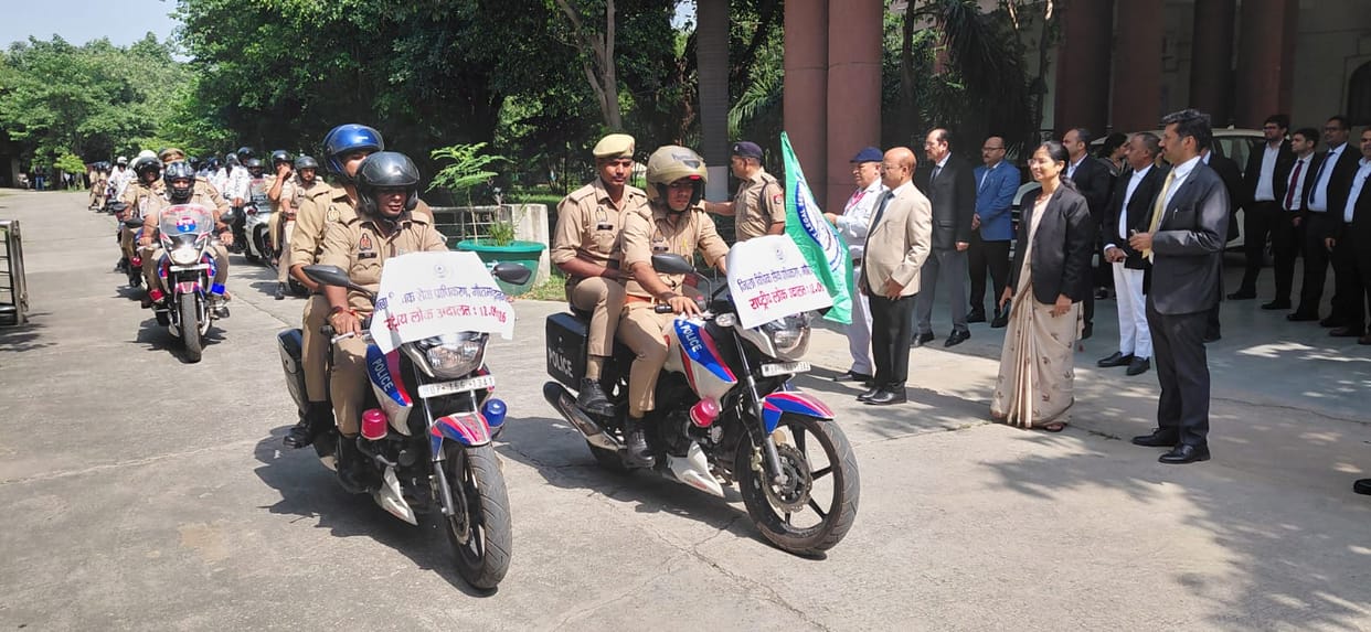 Traffic police organize bike rally to publicize National Lok Adalat.