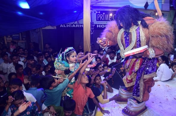 Devotees played Holi with flowers alongside Radha and Krishna