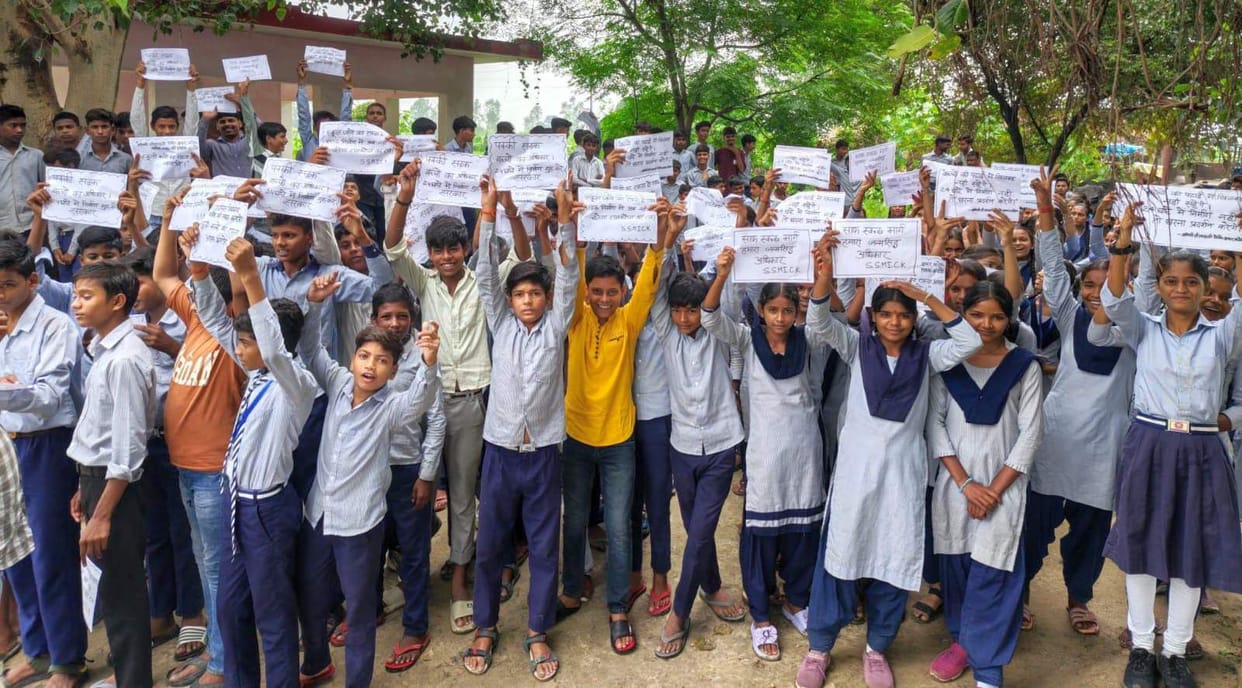 Paved road sanctioned yet remains in poor condition; students protest.