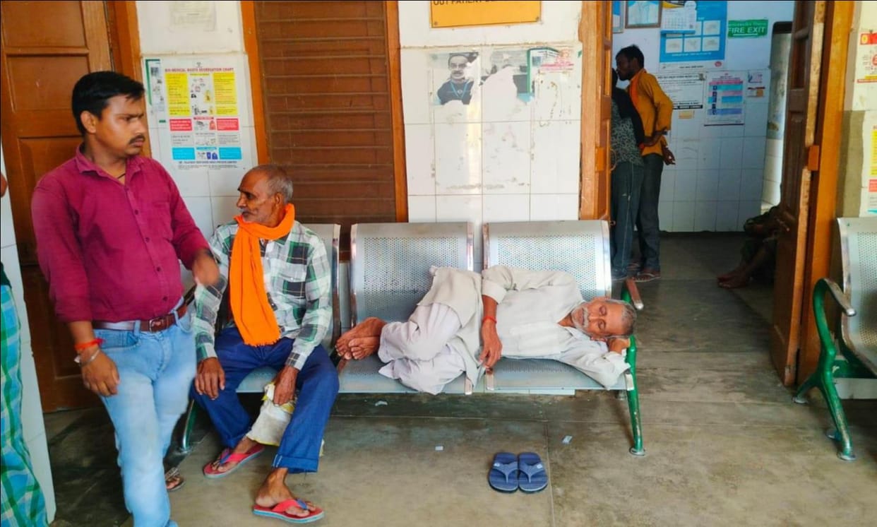 Shortage of beds at the CHC; patient administered IV drip while lying on a bench.