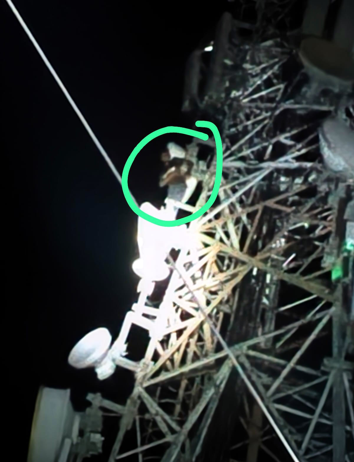Intoxicated man climbs tower, sits 150 feet up.