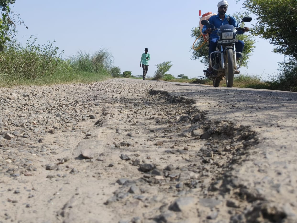 The route to Ranhera via the cargo road is in a dilapidated state, with potholes at various points.