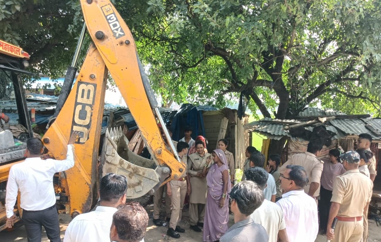 Bulldozer roars at the dam; villagers raise questions.