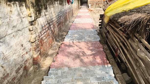 Allegations of laying interlocking tiles without a ballast base; DM orders an inquiry.