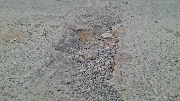 Potholes formed on the barrage bridge due to the movement of heavy vehicles