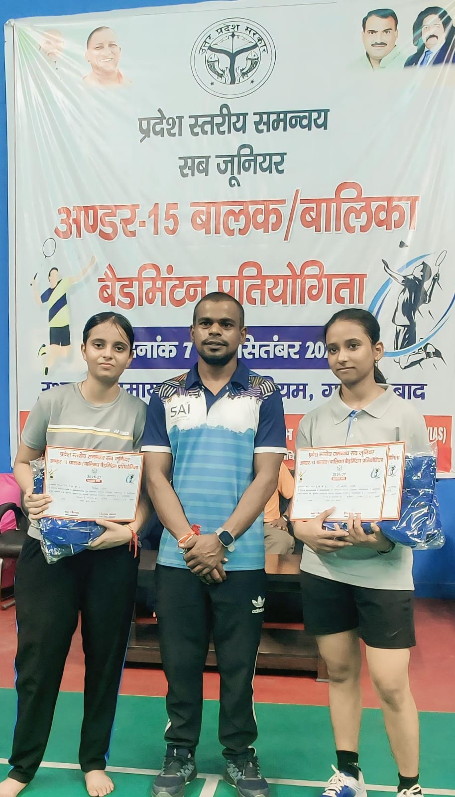 District shuttlers won one gold and one bronze medal.