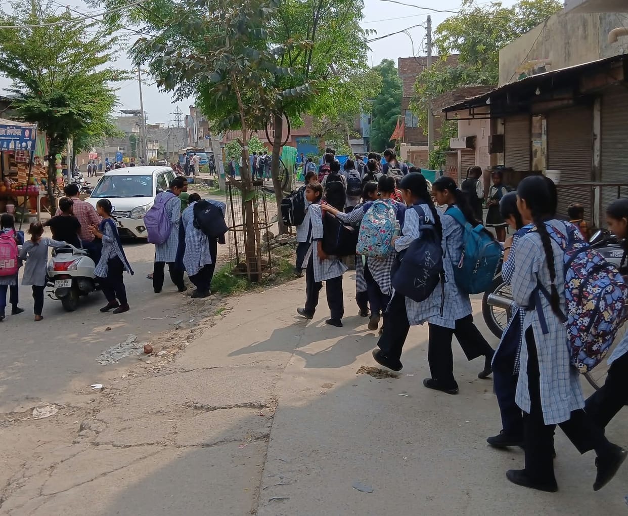 Students forced to travel on foot due to the unavailability of buses in the afternoon.