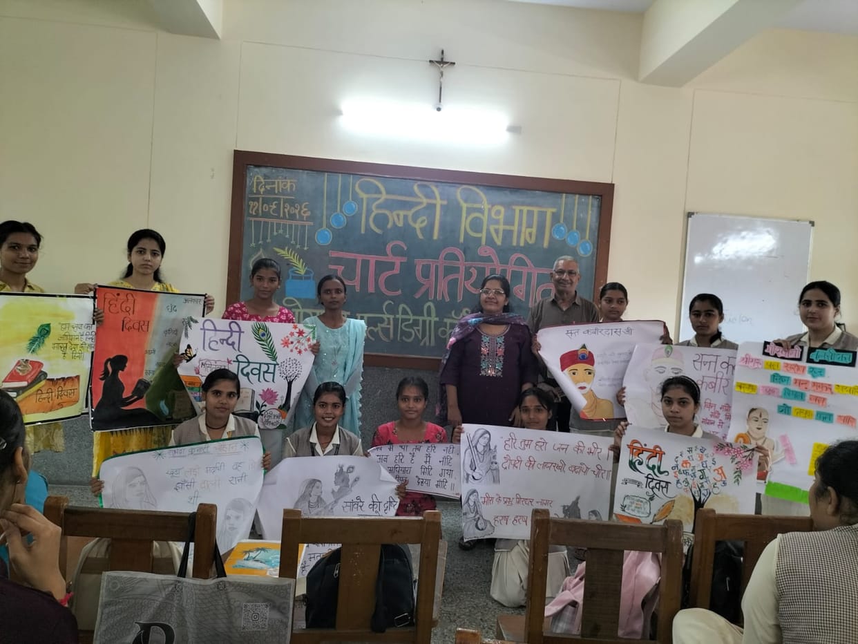 Female students showcased their creative talent through charts during Hindi Week.
