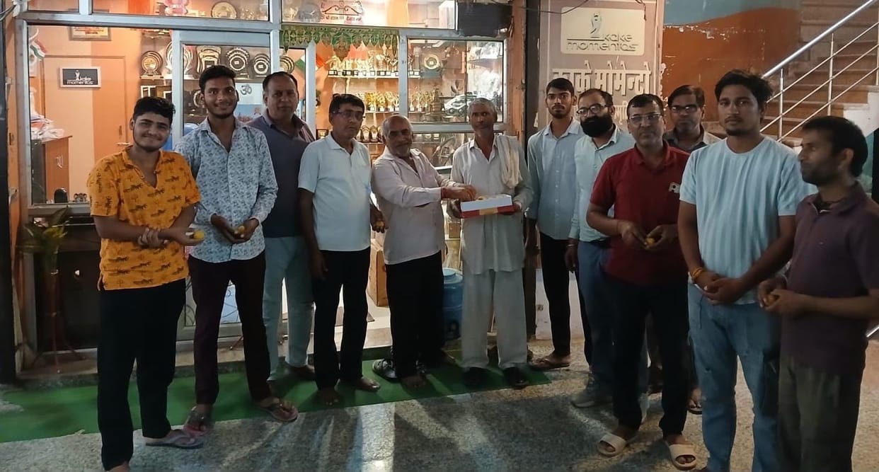 Shopkeepers distributed *laddus* after Vijay became the head.