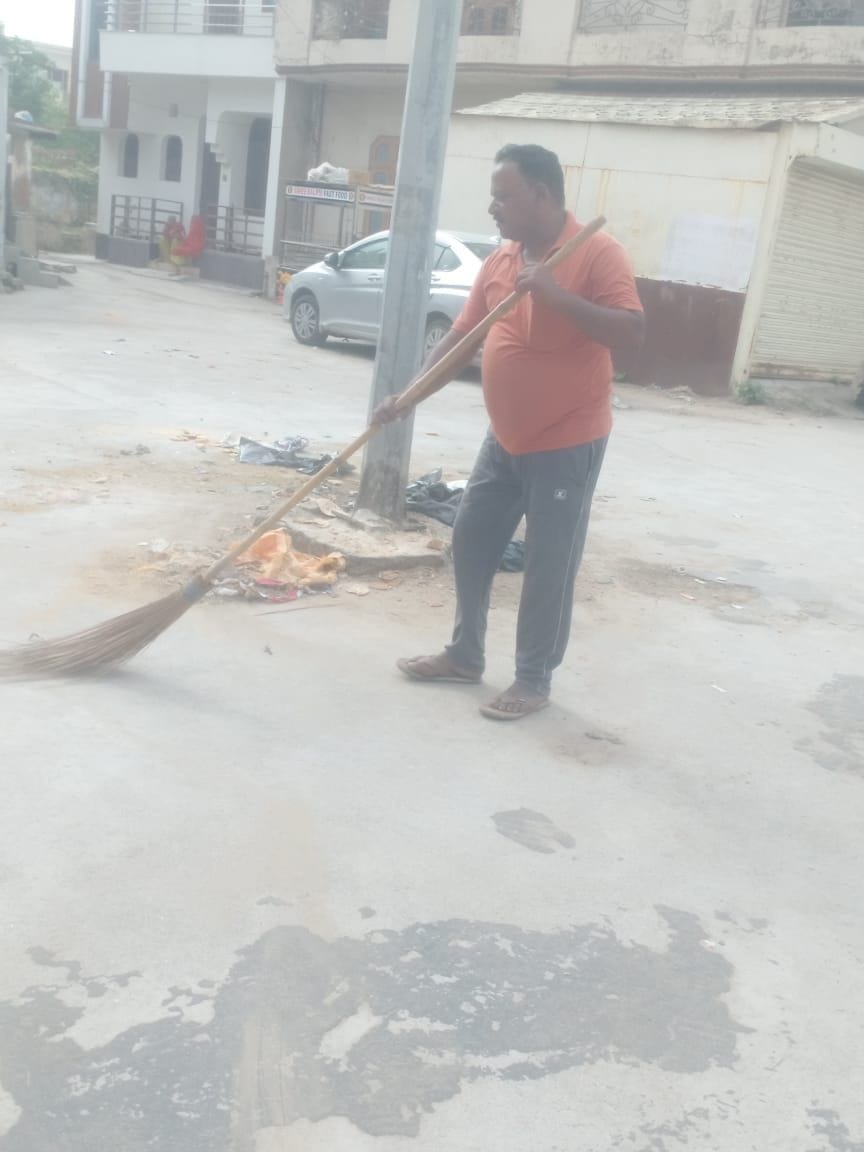 Brooms in hand after 37 days, yet mountains of garbage remain.