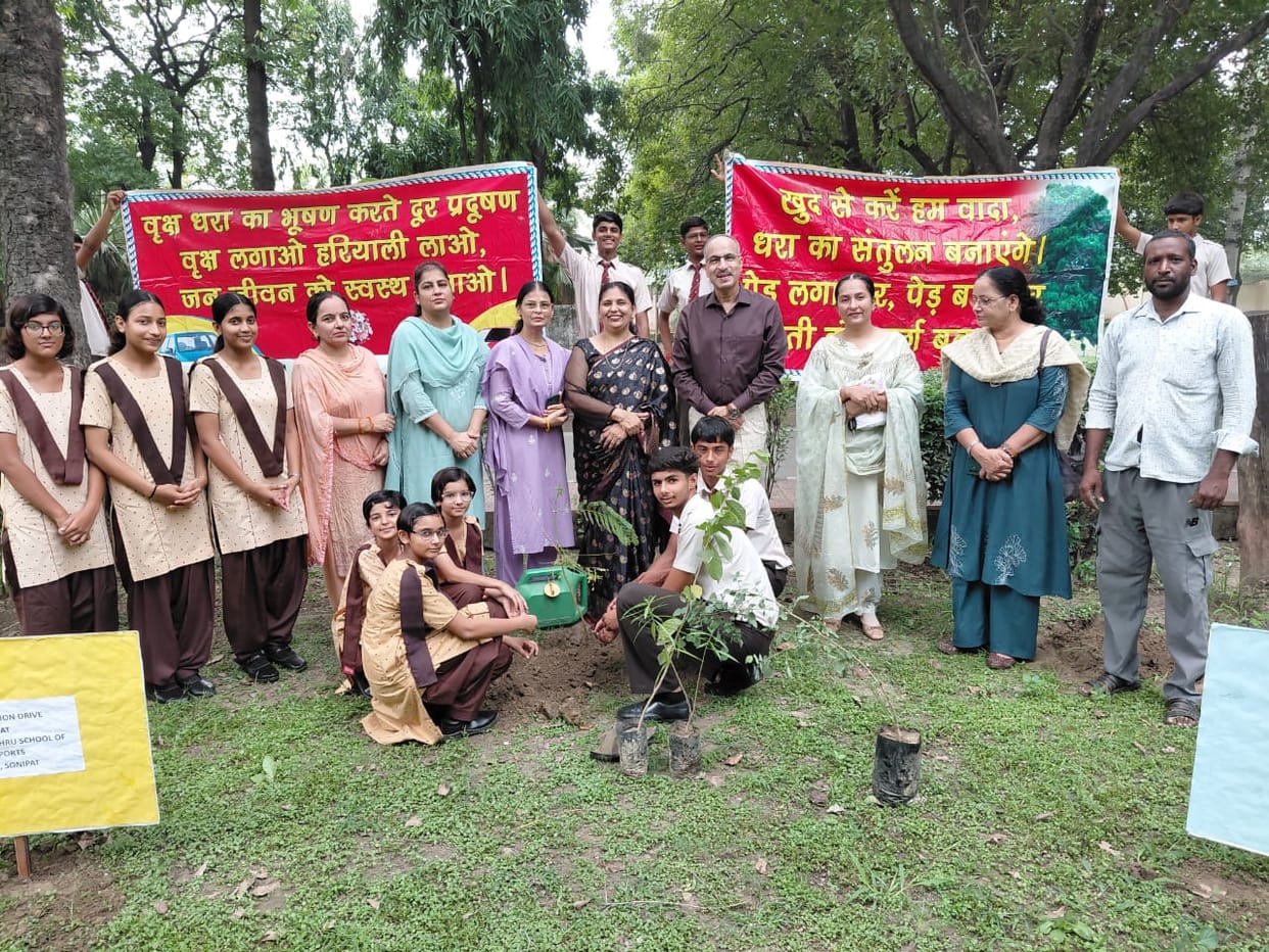 Students planted saplings, pledging to care for them.