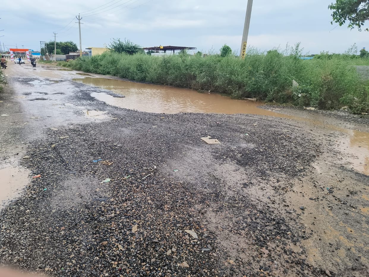 Potholes on the sector road pose a danger to motorists.