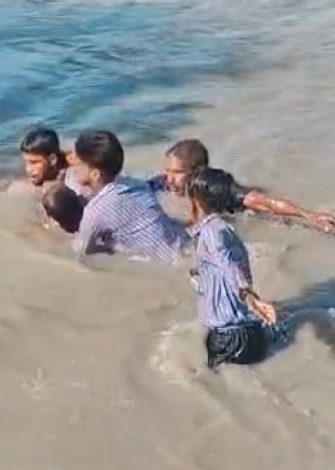 Two students jumped into the canal to save a drowning woman and rescued her.